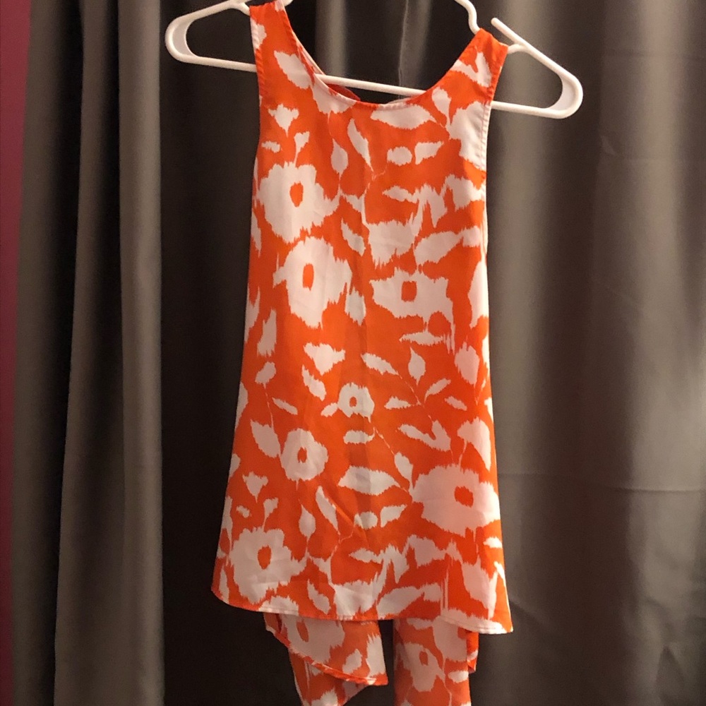 White and orange sleeveless blouse